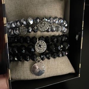 Nicole Miller stacked bracelets